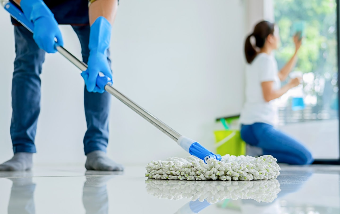 End of tenancy cleaning London professional team deep cleaning kitchen and surfaces